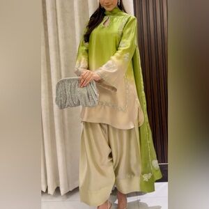 Elegant Green and Cream Outfit with Silver Clutch